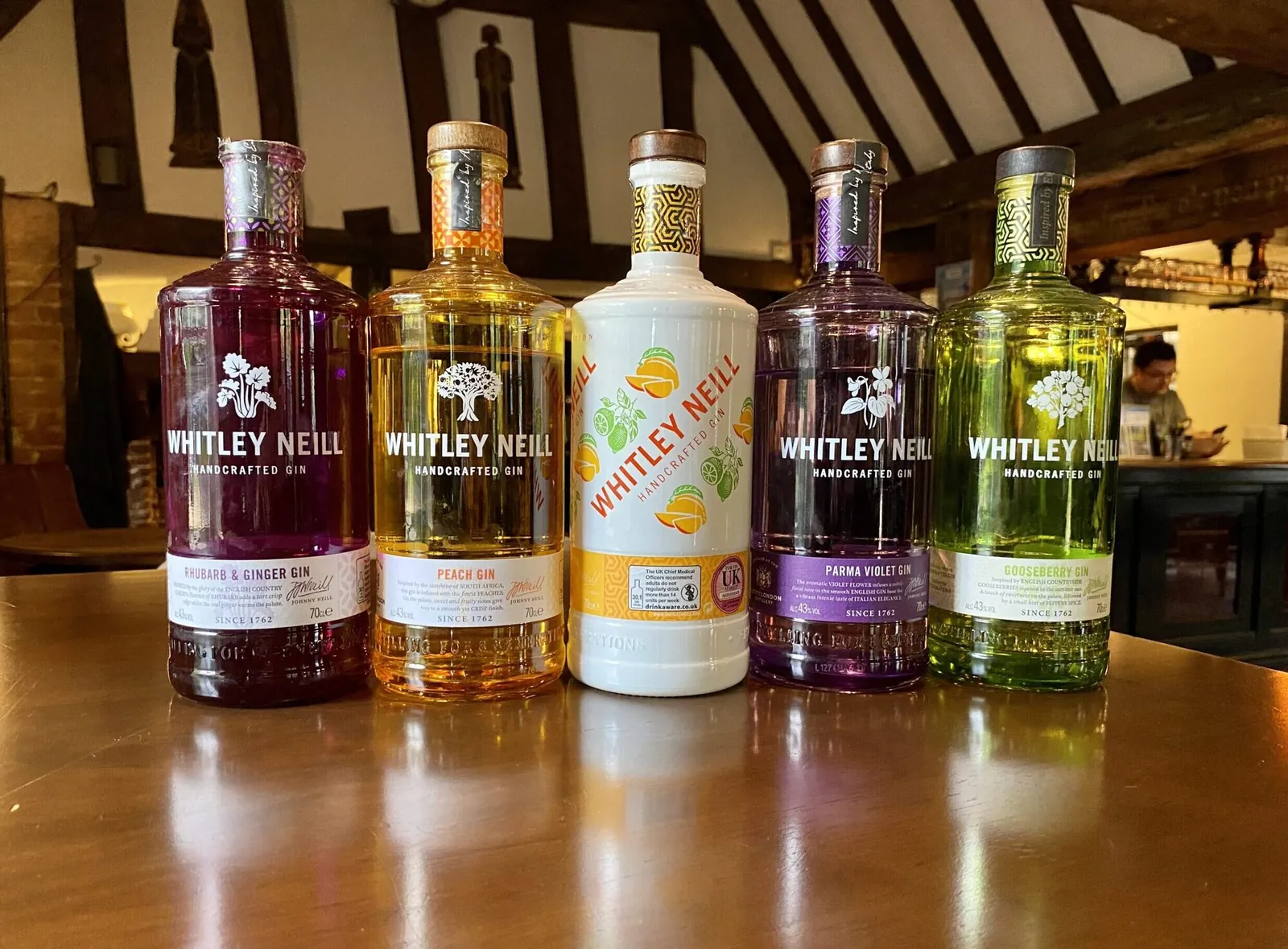 Gin bottles on the back bar at The Horns